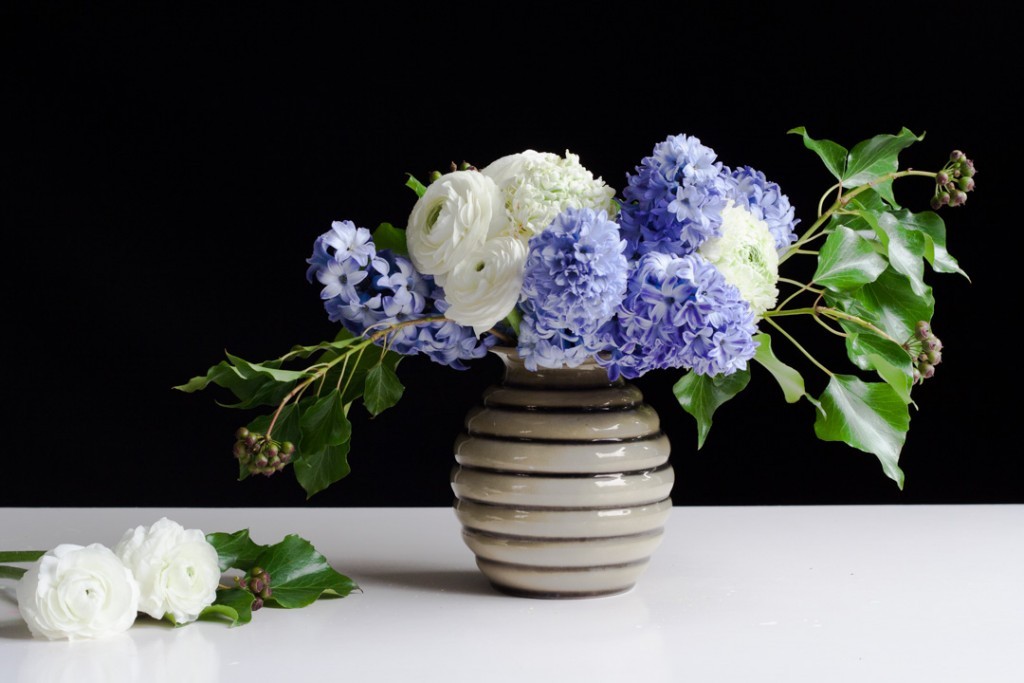 Flower arrangement with purple hyacinth and white ranunculus